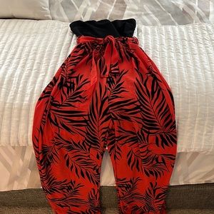 A red and black jumpsuit! New and never worn. Tags are attached.